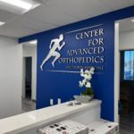 Custom Brushed Metal and Acrylic Lobby Logo Signs for Offices in Anaheim, CA!